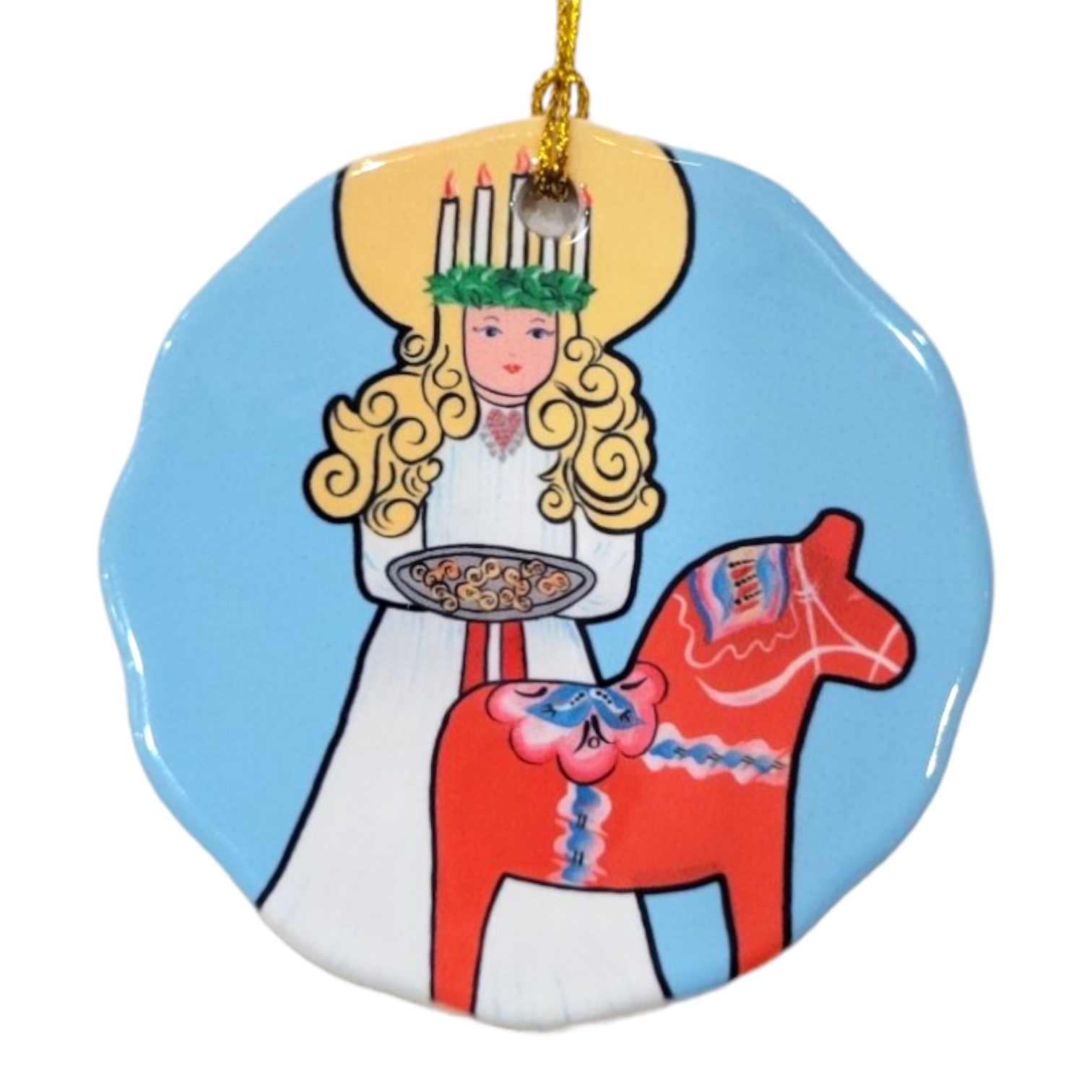 The "Ornament: Saint Lucia with Dala Horse Ceramic" features a porcelain depiction of a blonde woman in a white dress adorned with a candle crown, holding a plate next to a painted red horse against a blue background. This distinctive piece adds an enchanting touch to any decoration project.