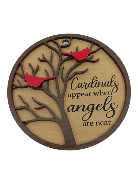 This ornament, titled "Ornament: 2-Cardinals 'Cardinals appear when angels are near'," features a circular birch wood plaque with a tree design adorned by two vibrant red cardinals. The heartfelt text adds warmth to any space.