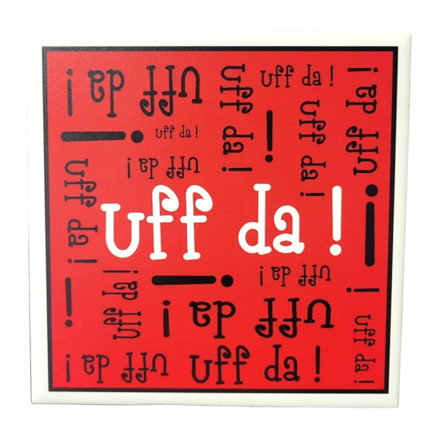 The Uff Da 6 Tile with cork backing and hanger features a red square design, displaying the Scandinavian phrase Uff Da! in black and white text oriented in various directions.