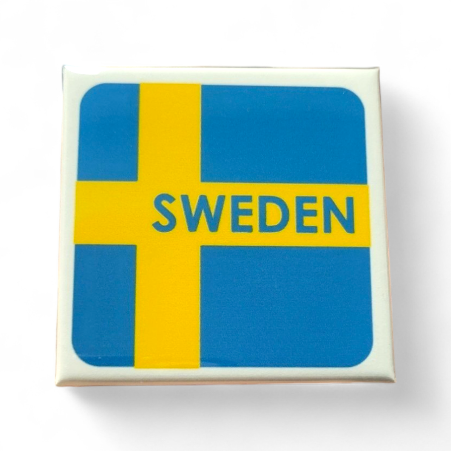 A 2-inch magnet portraying the iconic Swedish flag, displaying a blue background with a yellow Scandinavian cross and the word "Sweden" in the center.