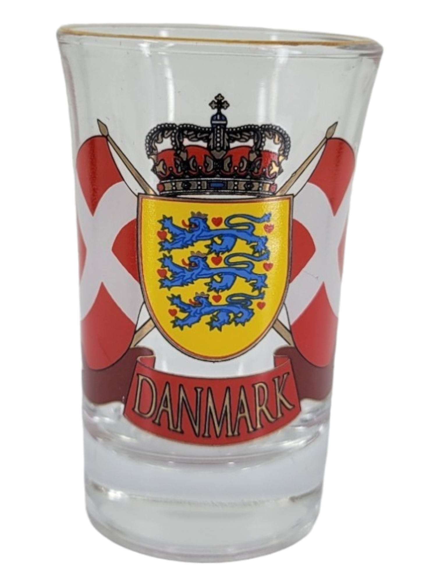 The Nordic 4 Pack shot glass set includes a clear glass that embodies Nordic charm, adorned with the word "Danmark" and featuring a crest with three blue lions on a yellow shield, surrounded by Danish flags.