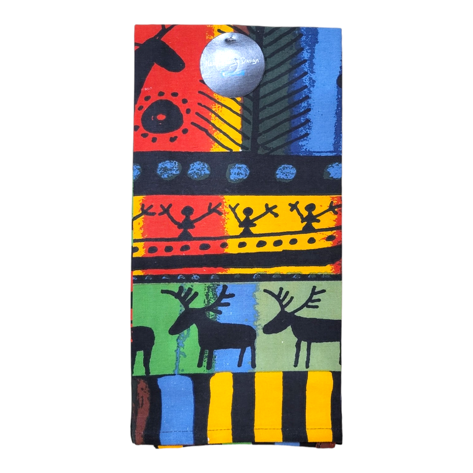 The Tea Towel: Sami Designs by Heidi Lange showcases abstract patterns in red, yellow, blue, and green with multicolored tones. It incorporates silhouette images of people and animals that capture the essence of Sami life in northern Sweden. A circular tag is attached at the top.