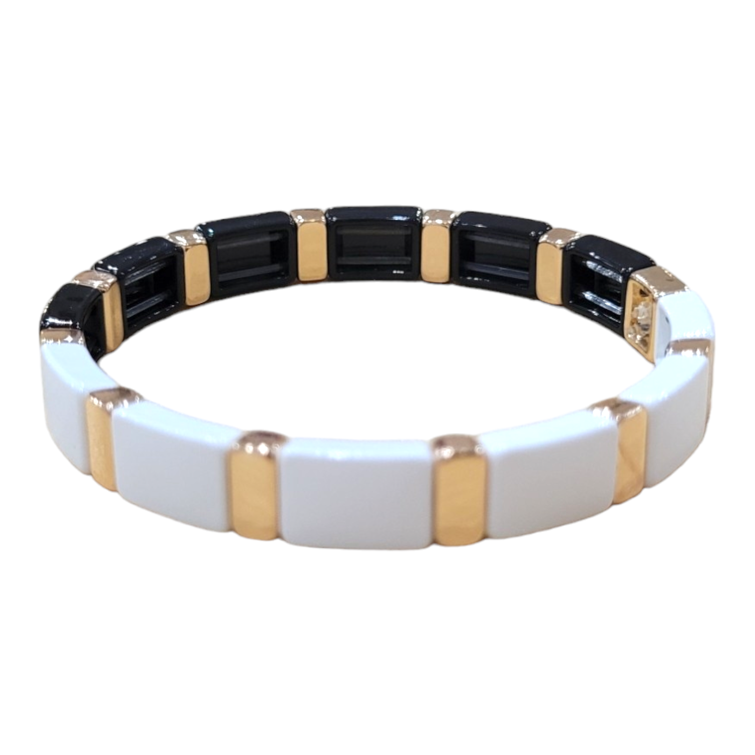 Introducing the Bracelet: Black/White Enamel Tile, a rectangular link bracelet in black and white, enhanced with gold accents and elegant enamel tiles.