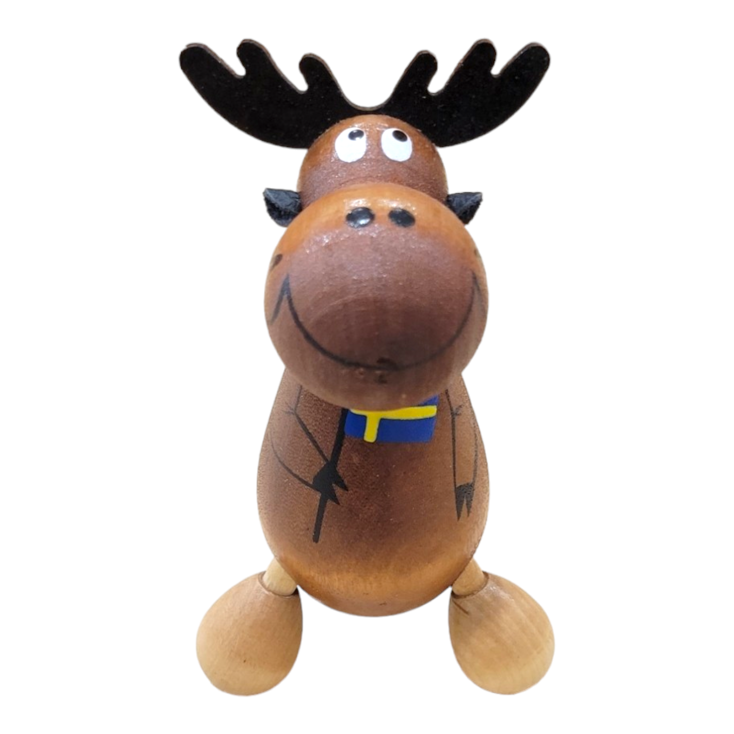 The Wooden Moose Massager features black antlers, a painted smile, and a blue and yellow ribbon around its neck. Photographed on a white background.