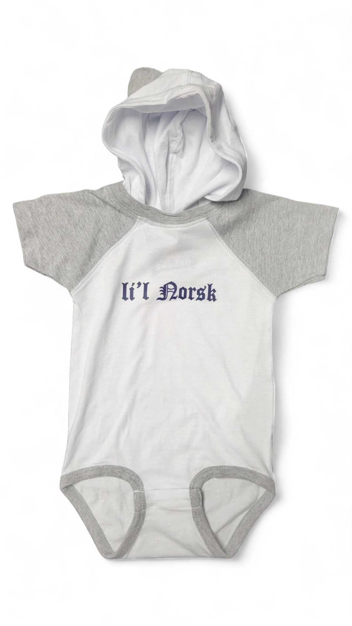 The "Onesie: Lil Norsk with Hood (12mo)" features a white body, gray sleeves, and a hood, perfect for your little one aged 12 months. The phrase "Li'l Norsk" is charmingly written in blue on the front.