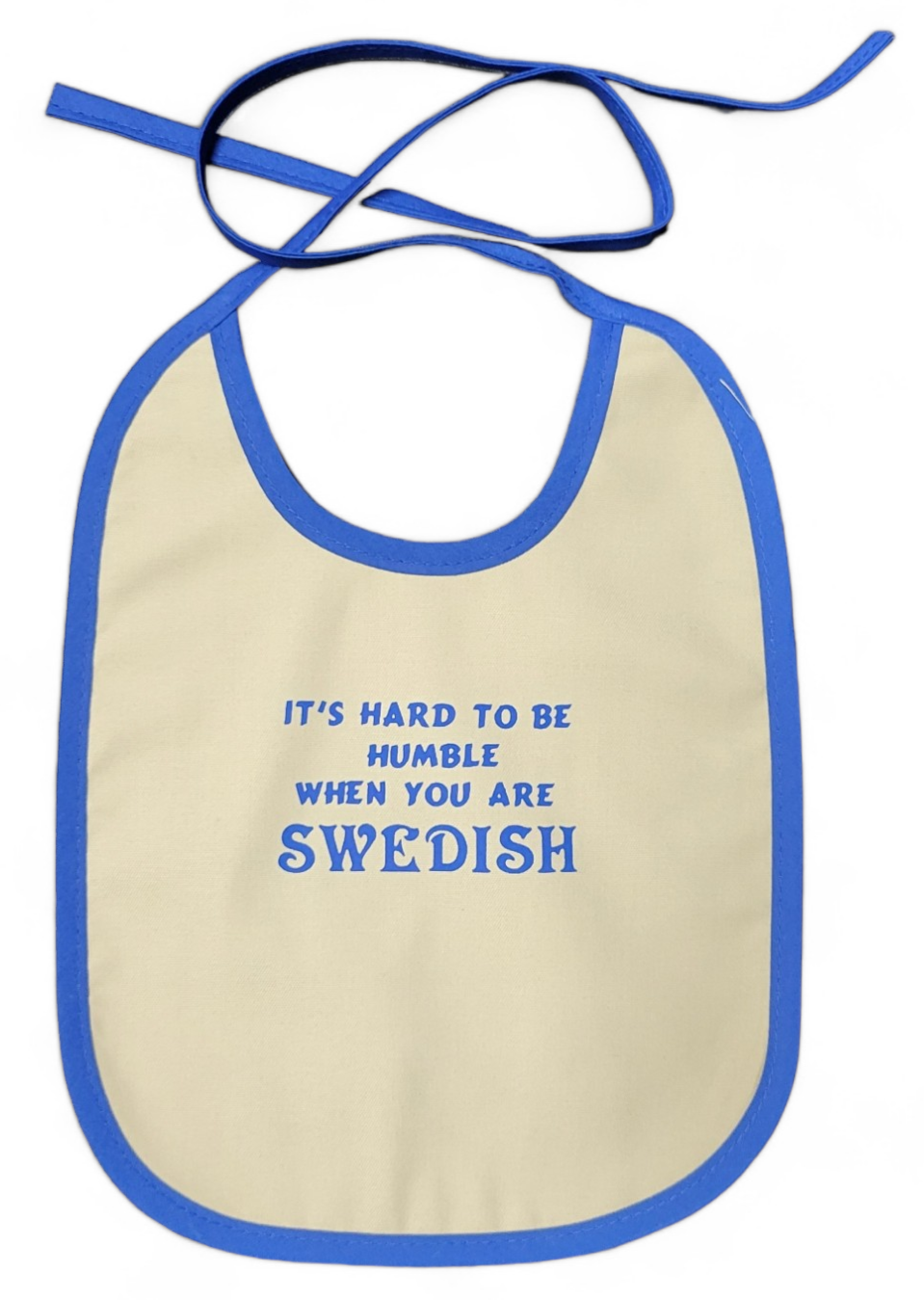 The beige bib, outlined in blue, displays the fun message: "It's Hard to be Humble When You Are Swedish.