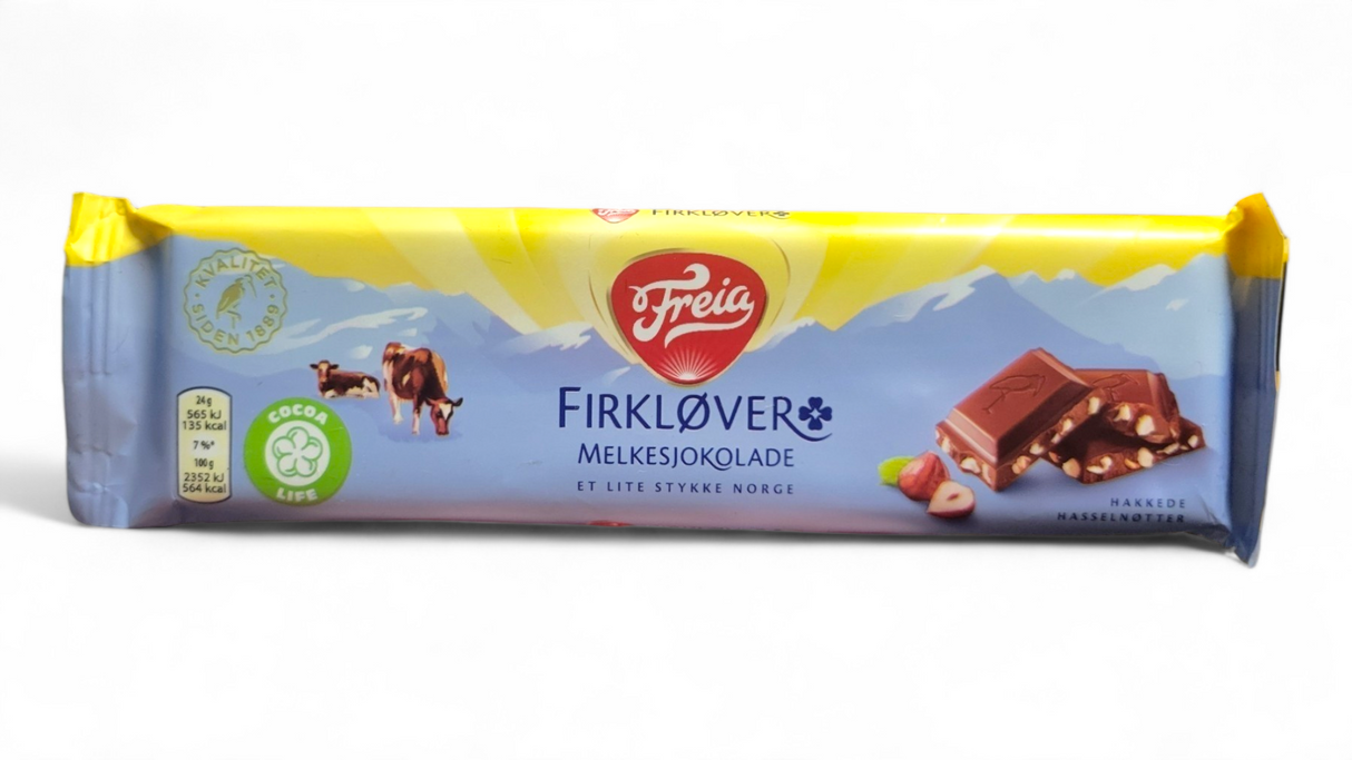 Indulge in a 60g Freia Firklover milk chocolate bar, infused with rich hazelnuts and inspired by Norway's scenic landscapes, showcasing cows and mountains on its packaging.