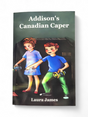 Autographed "Addison's Canadian Caper" by Laura James features kids with flashlights exploring darkness, with a hint of the Royal Canadian Mounted Police—an ideal choice for creative writing contests.