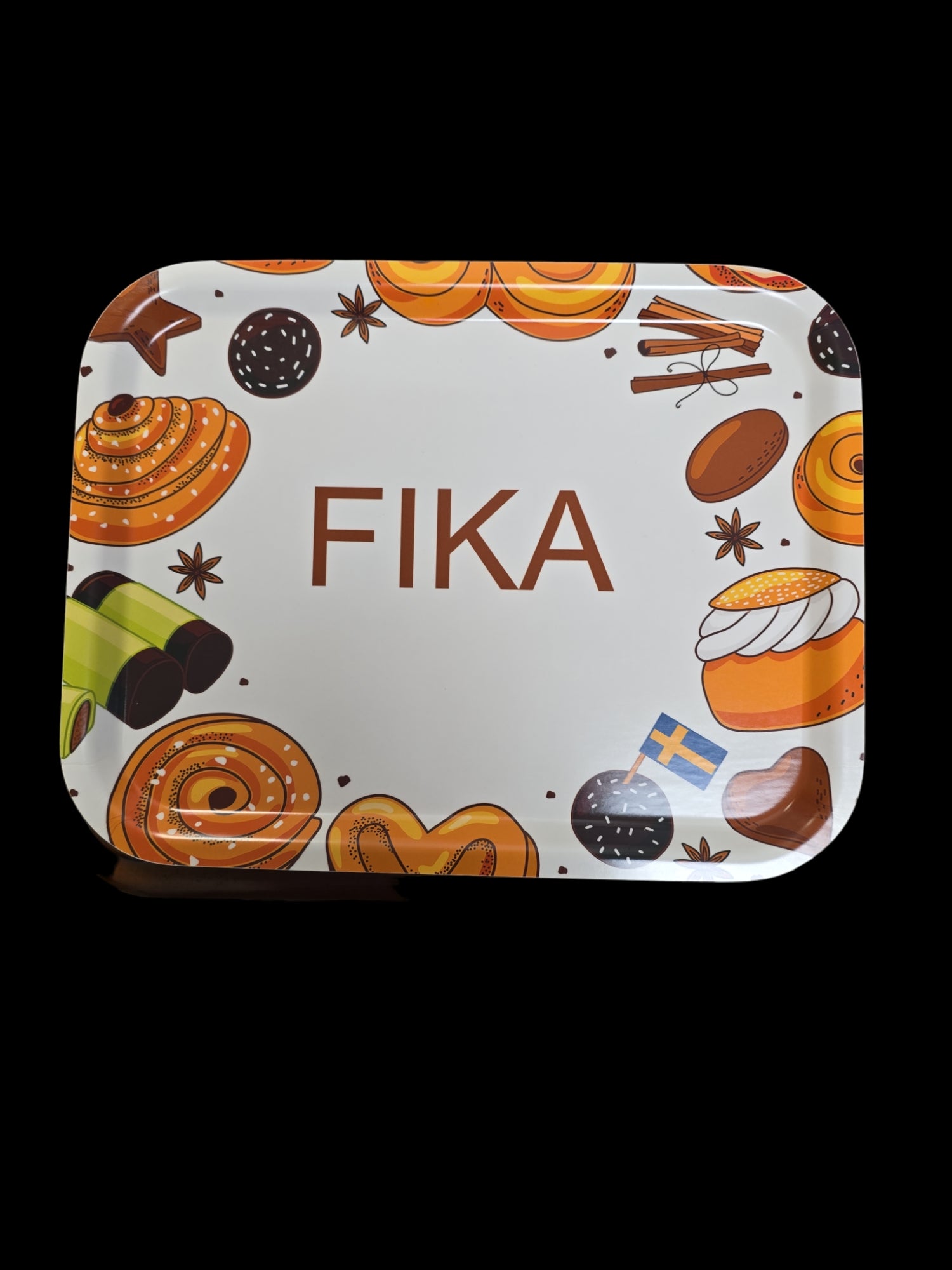 The Tray: FIKA is crafted from birch wood and highlights the word "FIKA" at its center, encircled by enchanting illustrations of Swedish pastries alongside a small Swedish flag, embodying the spirit of a delightful Swedish coffee break.