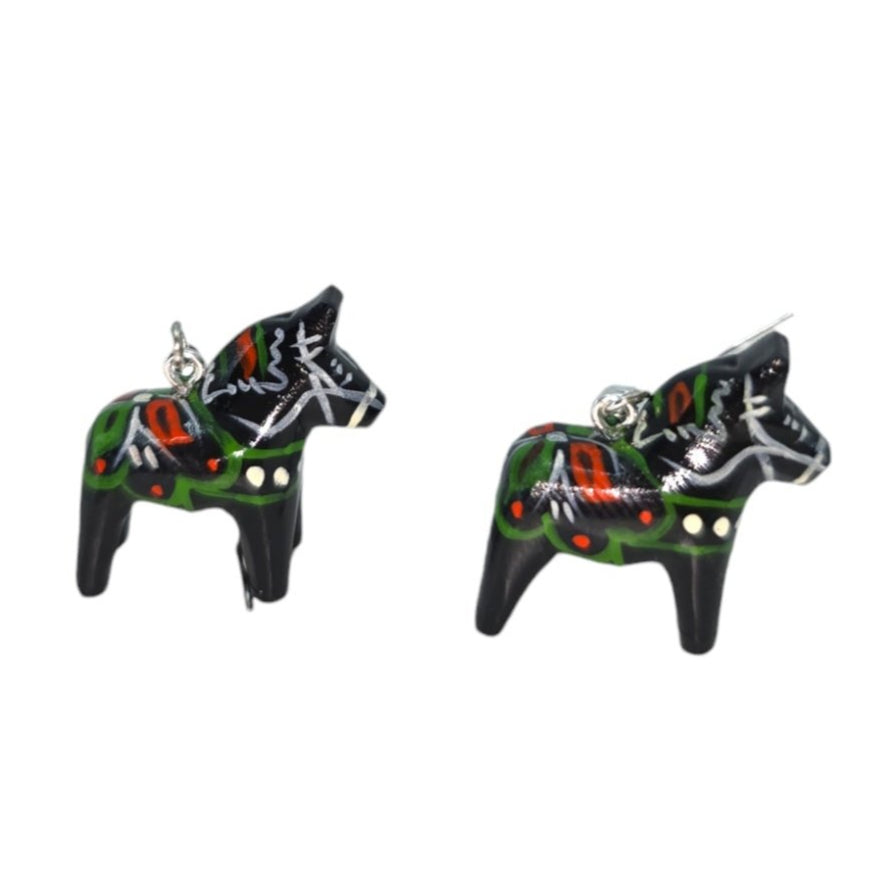 Displayed against a plain white background are the Dala Earrings Black 2cm, featuring two small, black, hand-crafted earrings shaped like Dala Horses with colorful patterns and silver hooks.