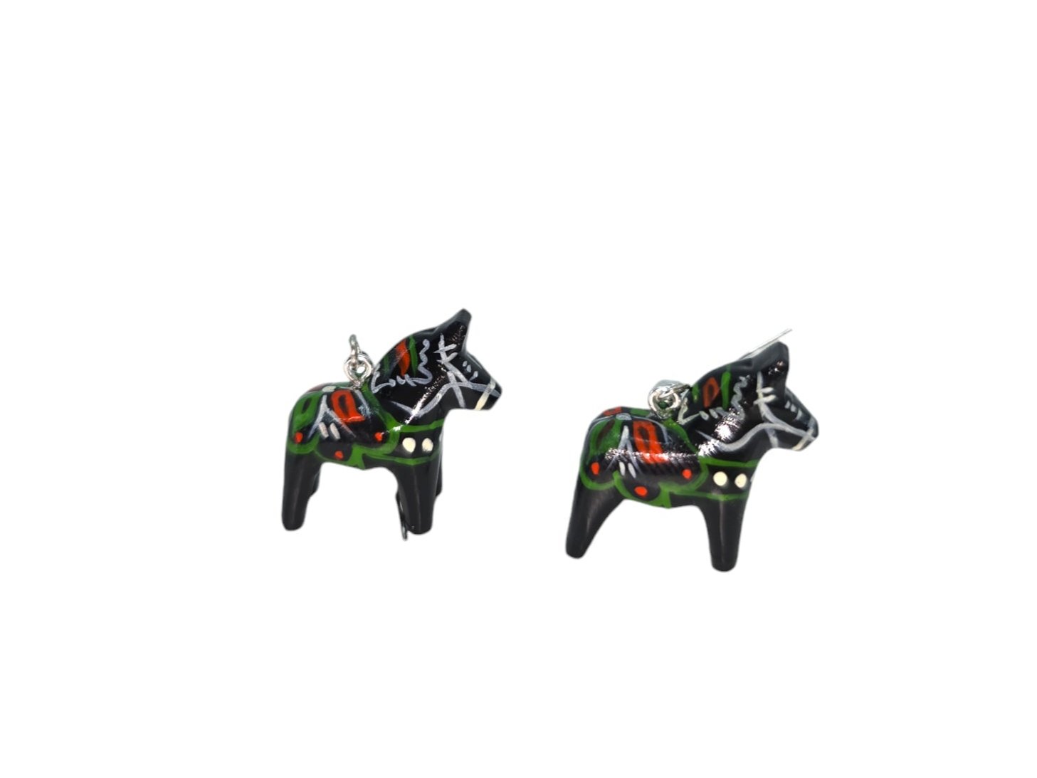 Displayed against a plain white background are the Dala Earrings Black 2cm, featuring two small, black, hand-crafted earrings shaped like Dala Horses with colorful patterns and silver hooks.