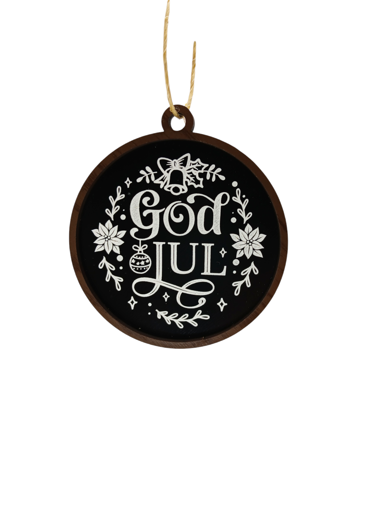 The Ornaments: God Jul Black with White Lettering & Trim captures the essence of a cherished Swedish holiday tradition, featuring "God Jul" to mean Merry Christmas in Swedish, embellished with floral patterns and a bell.