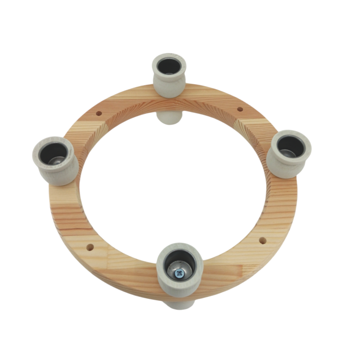 The White Handcrafted Swedish Candle Ring is a wooden circular holder with four light-colored cylindrical sockets, perfect for customizable decoration.