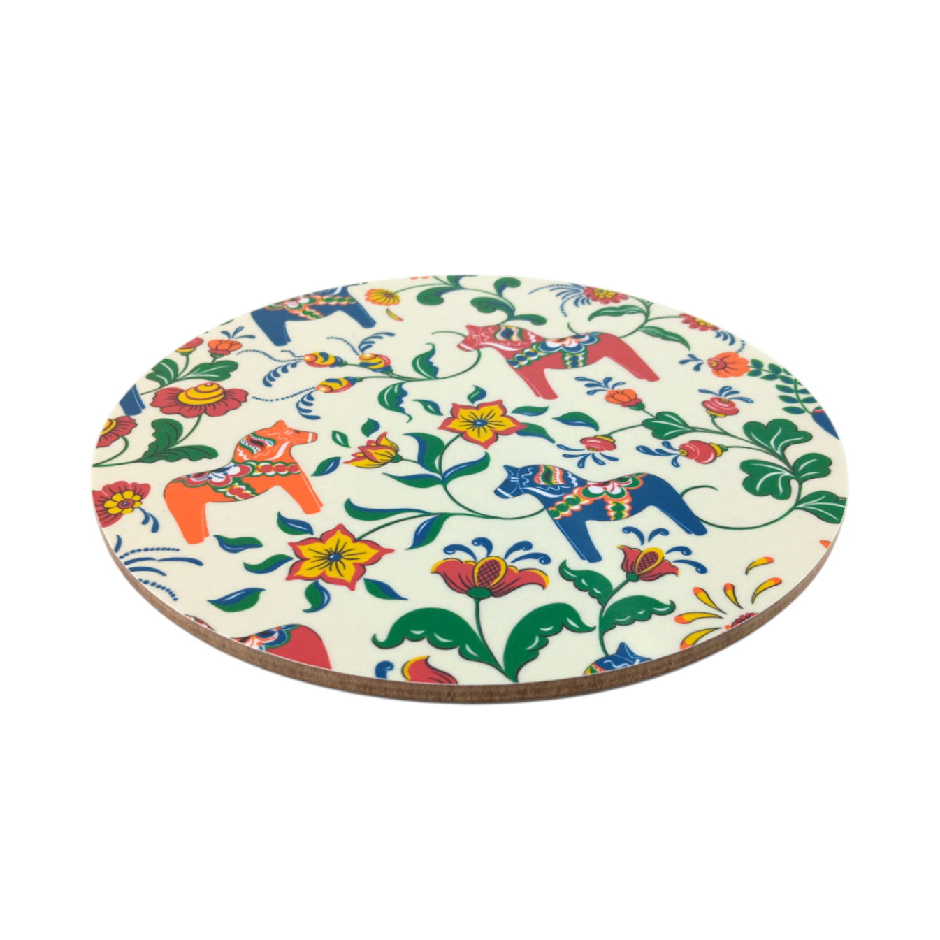 The Leksand Cream Circular Trivet, handmade in Sweden, features colorful floral patterns and decorative Dala horse motifs on a crisp white background.