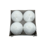 The Candles: Logum Kloster Lys 2.5 Ball Candles (4 Pack) includes four round white candles in a cardboard tray, wrapped in clear plastic—ideal for a cozy HYGGE vibe or as stylish Advent candles.
