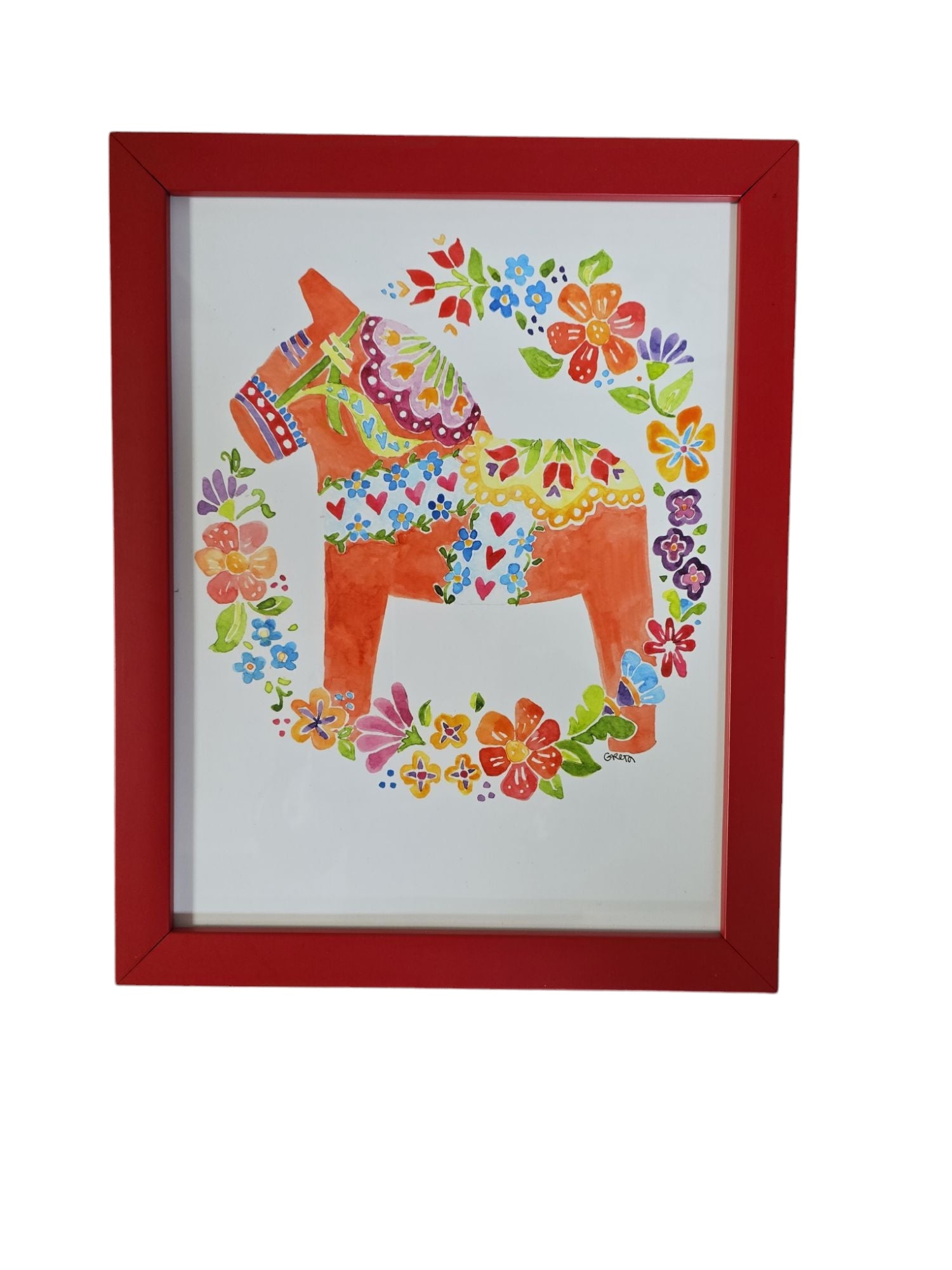 The Dala Horse artwork by Greta Lann is a vibrant watercolor print showcasing a colorful Dala Horse surrounded by intricate floral designs and elegantly framed in red.