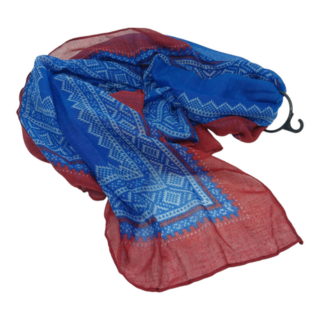 The Scarf: Marius Blue & Red Scandinavian Design Scarf features a lightweight blue and maroon color scheme with geometric white patterns, inspired by Scandinavia. Displayed on a white background with a plastic hanger.
