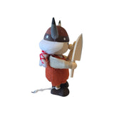 Viking gnome figurine wearing a horned helmet and holding a wooden shield.