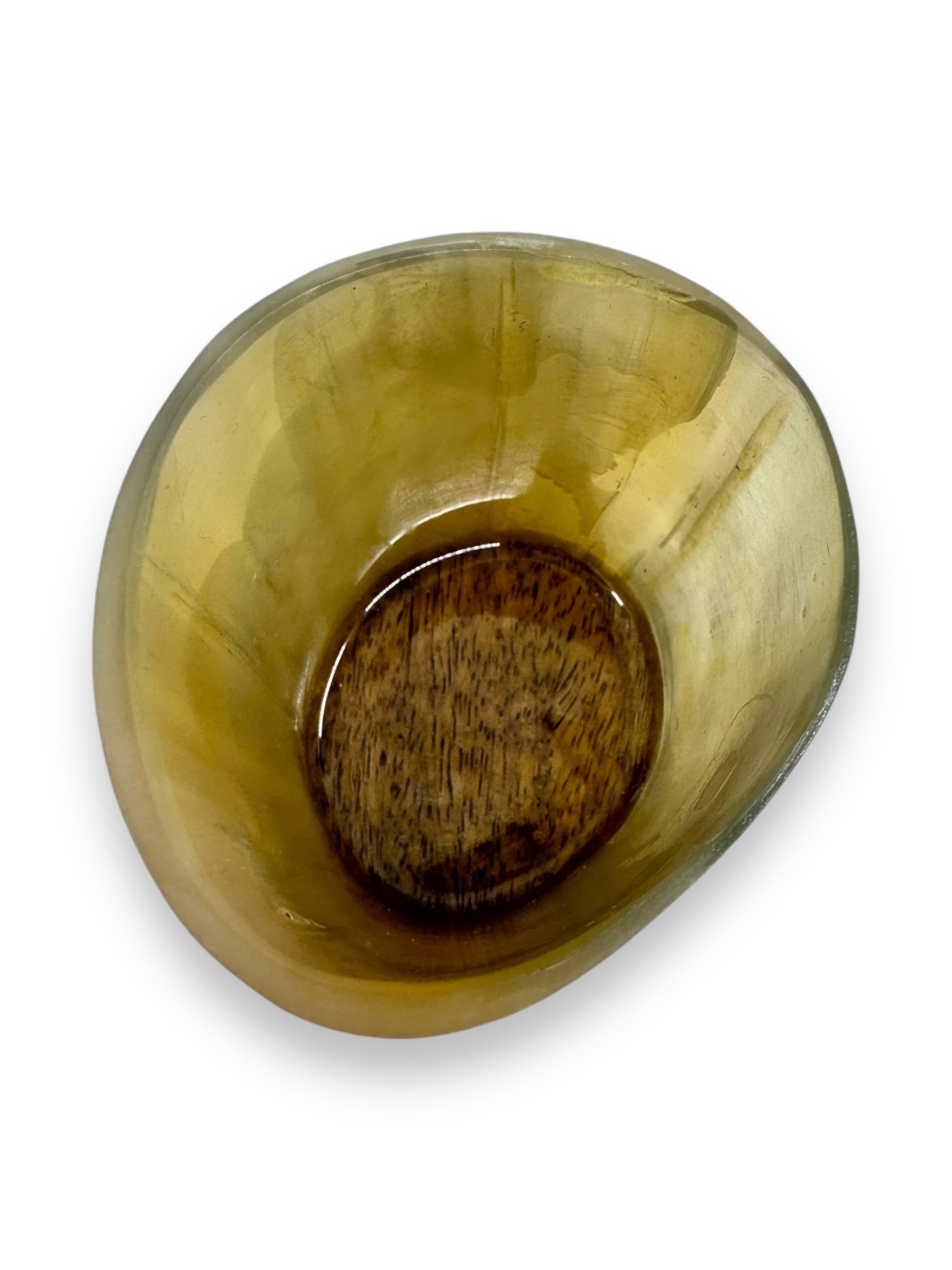 A textured, translucent yellow bowl crafted from premium mango wood is viewed from above, revealing a rough, brown interior base.

Product: Horn: Viking Drinking Horn Shot Glass

Rewritten Sentence: A Viking Drinking Horn Shot Glass showcases its intricate textures and translucent tones, echoing the craftsmanship seen in premium mango wood designs.