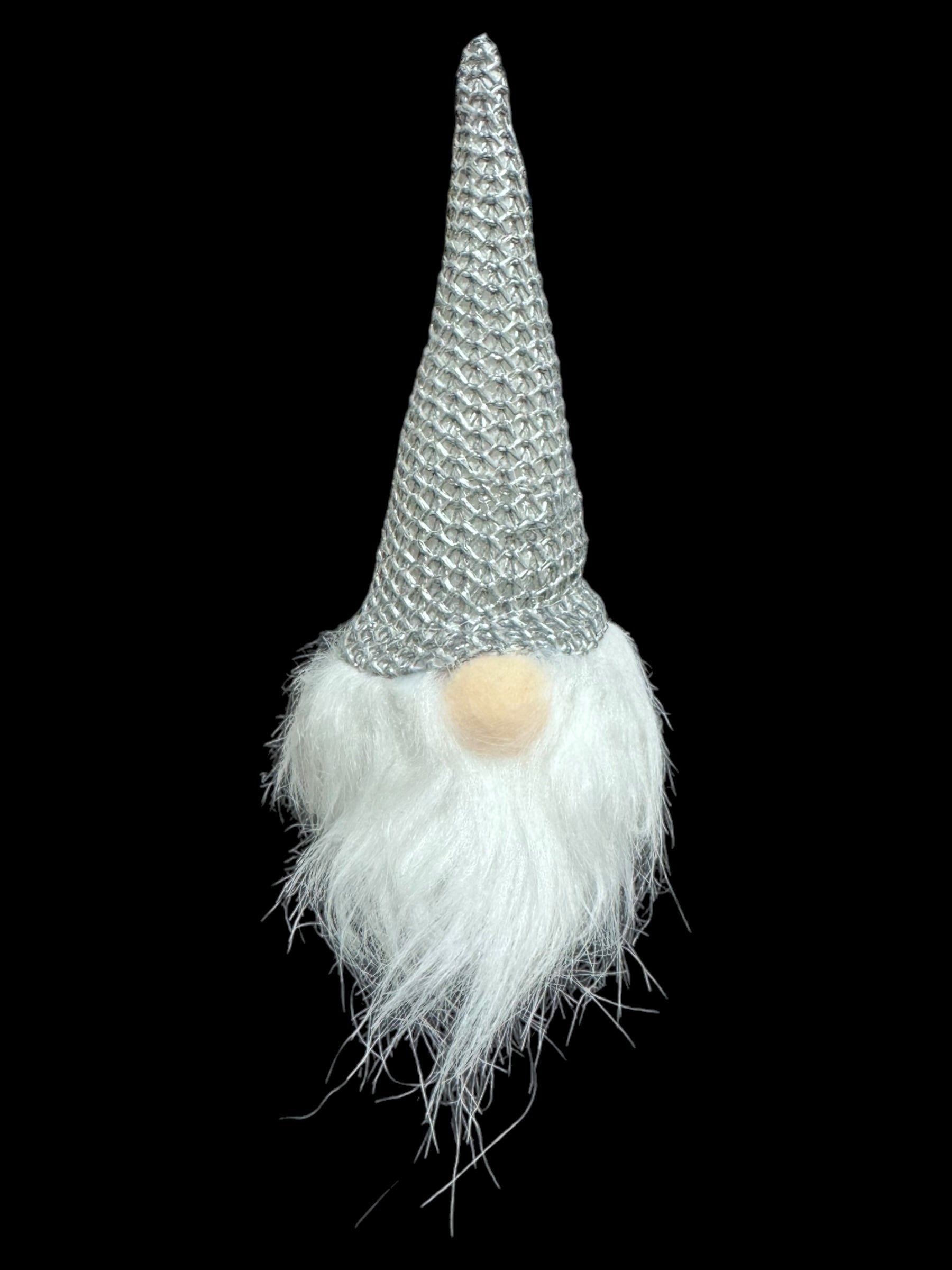 Ornament: Light Up Tomte Gnome, featuring a gray gnome with a knitted hat and fluffy white beard, includes A76 (LR44) batteries and is displayed against a black background.