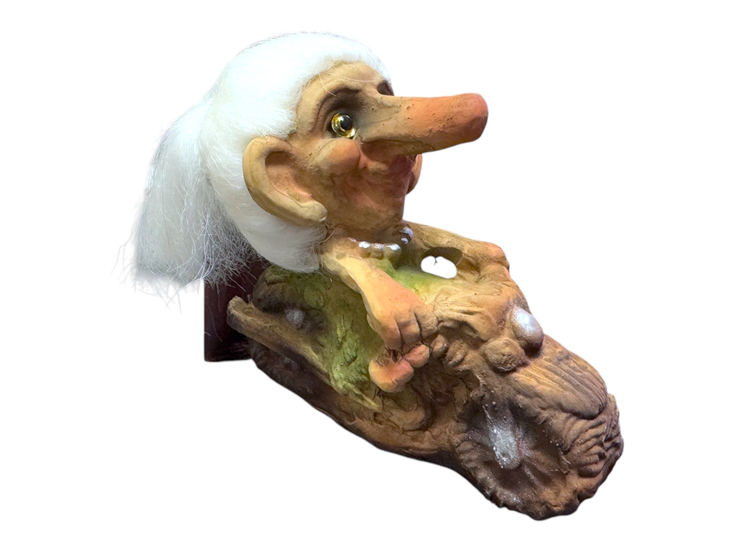 The Troll: NyForm - Troll Chick on Motorcycle showcases a whimsical creature with white hair, a large nose, and big eyes, playfully perched on a textured brown and green base. This piece beautifully captures the essence of Norwegian Design inspired by classic NyForm Trolls.