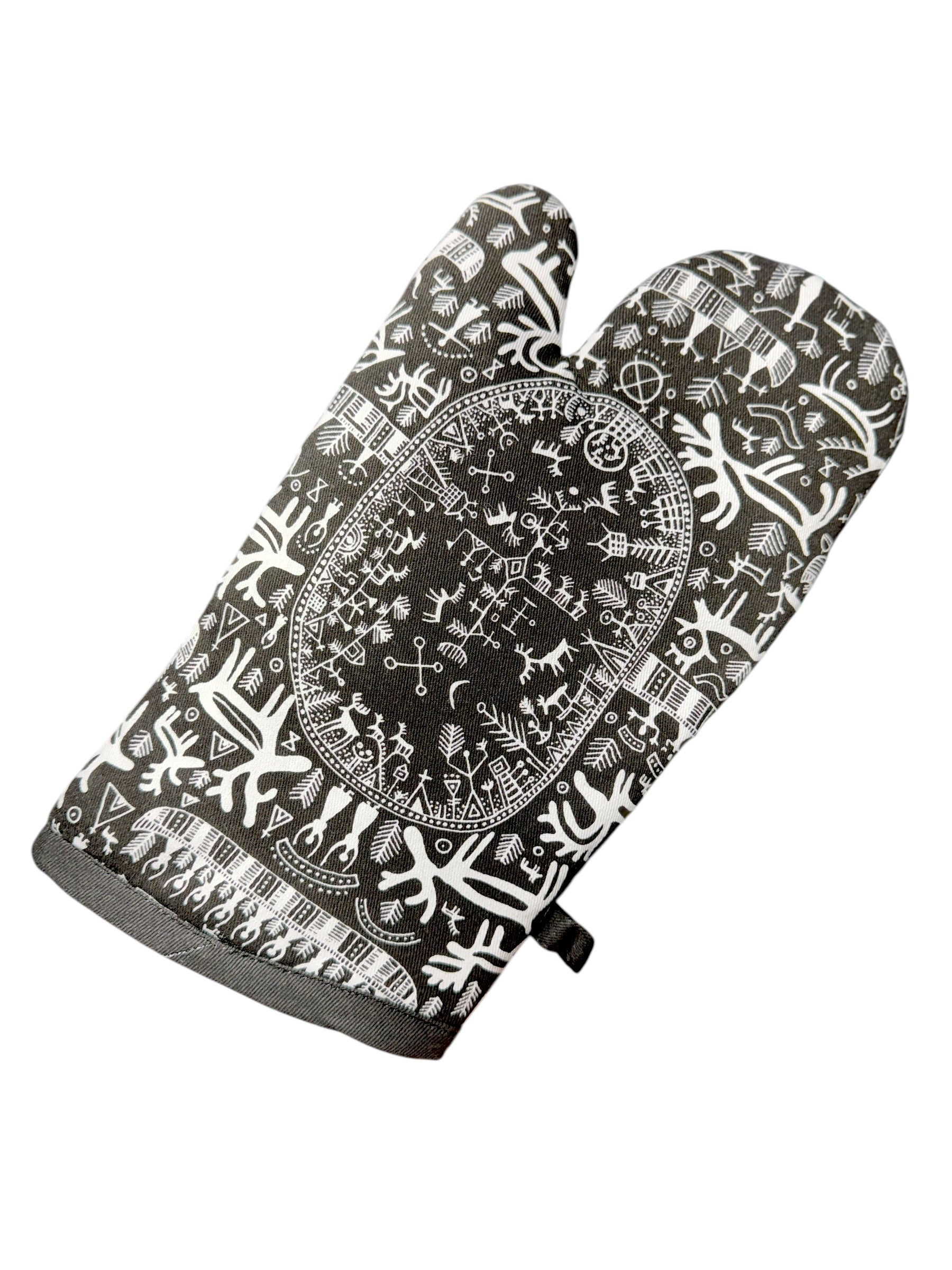 The Oven Mitt: Noir Sami Drawings by Heidi Lange features intricate black and white Nordic-inspired abstract patterns and symbols, shown on a white background.
