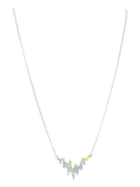 A delicate silver plated necklace inspired by Norwegian jewelry, the Northern Lights A&C Oslo Norway features a central design with blue and green crystals for an elegant touch.