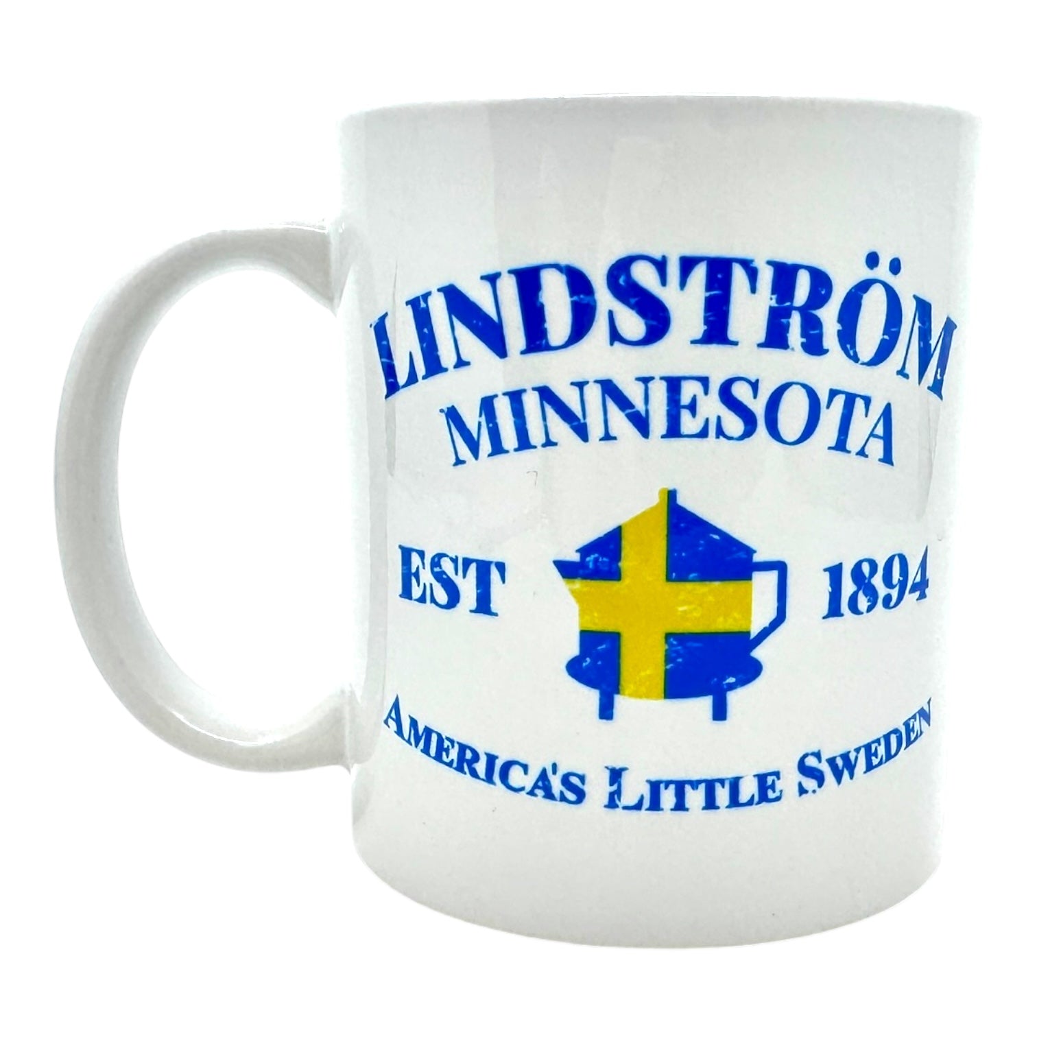 An 11oz ceramic mug featuring the text "LINDSTRÖM MINNESOTA EST 1894" and "America's Little Sweden," complemented by a design incorporating the Swedish flag's colors along with a coffee pot.