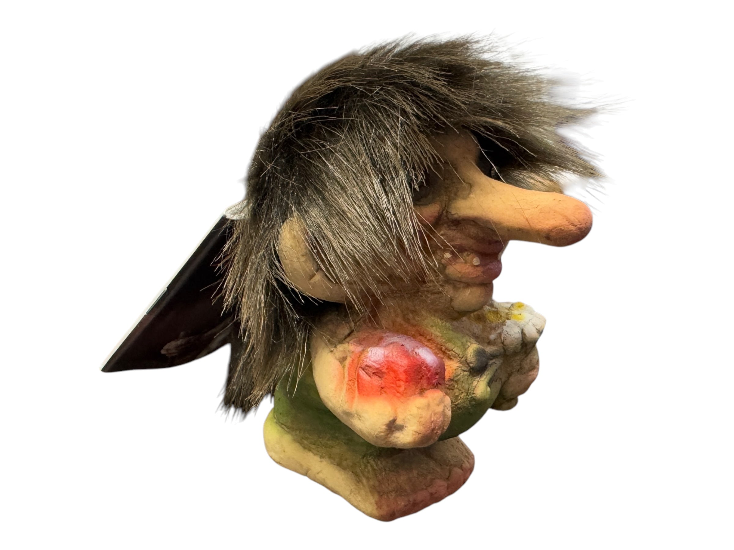 The NyForm Troll Boy with Candy & Flowers figurine is a charming emblem of Norwegian design, featuring a large nose under a faux fur hood while holding candy and flowers. This delightful collectors piece captures the whimsy and artistry of traditional folklore.