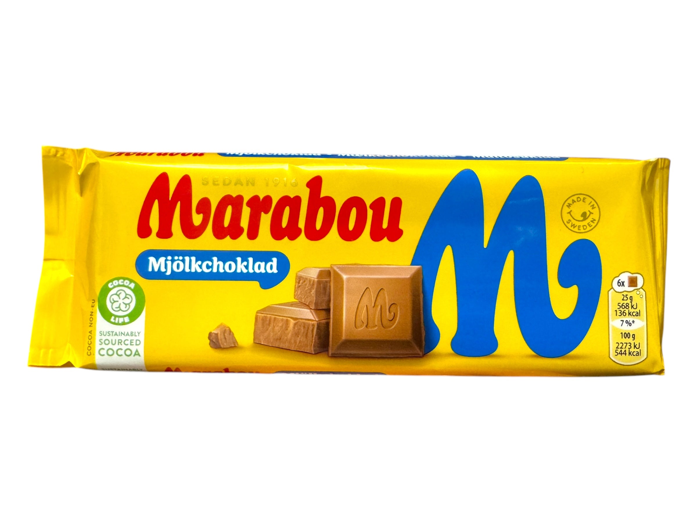 The Marabou Original Milk Chocolate (100g) packaging, adorned with a blue and yellow design, displays tempting chocolate pieces on the front. It proudly features a sustainability certification logo and includes cocoa butter for a rich, creamy taste.