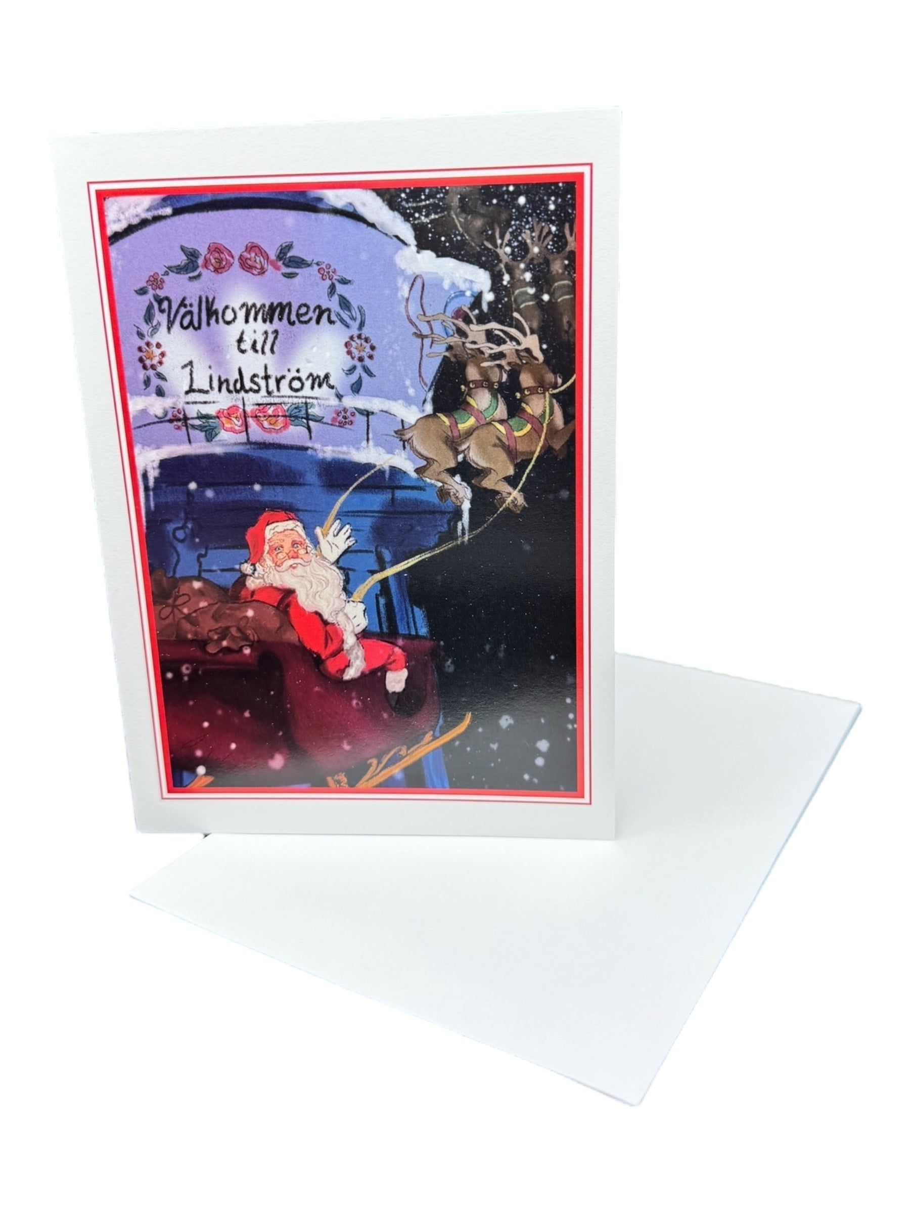 The Card: Santa in Lindström – Holiday Greeting Card (5×7 in) features Santa, reindeer, snow, Swedish text Välkommen till Lindström, celebrating Swedish heritage; includes a white envelope.