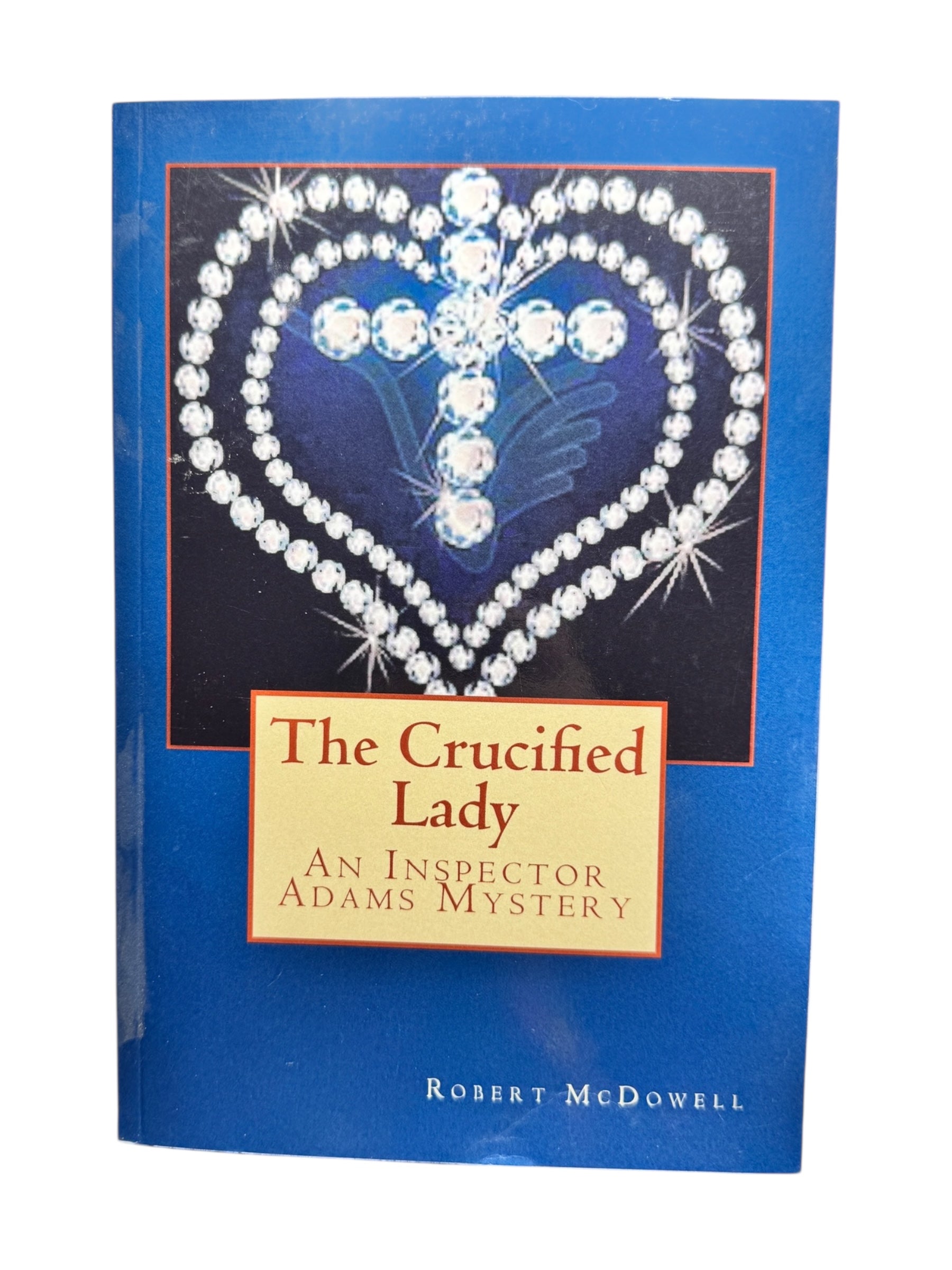 Book: The Crucified Lady an Inspector Adams Mystery by Robert McDowell