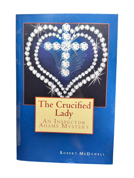 Book: The Crucified Lady an Inspector Adams Mystery by Robert McDowell, with a jeweled heart and cross on a blue cover—ideal for fans of Scotland Yard detective fiction.