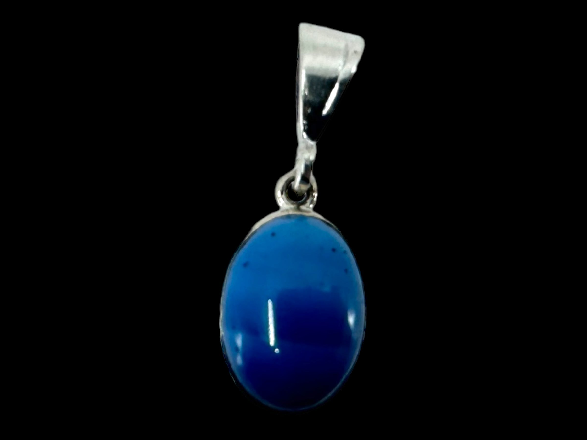 The Pendant: Plain Oval - SwedishBlue features a beautiful Swedish Blue oval gemstone set against a striking sterling silver background.