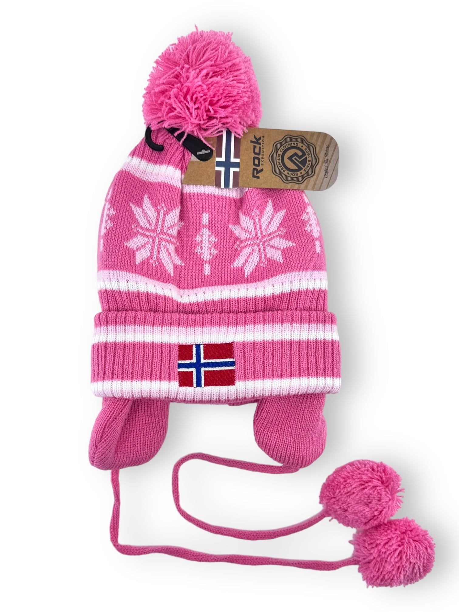 The Rock Expedition - Child's Acrylic Hat in pink features a white snowflake pattern, pom-poms, ear flaps, and displays the Norwegian flag on the brim.