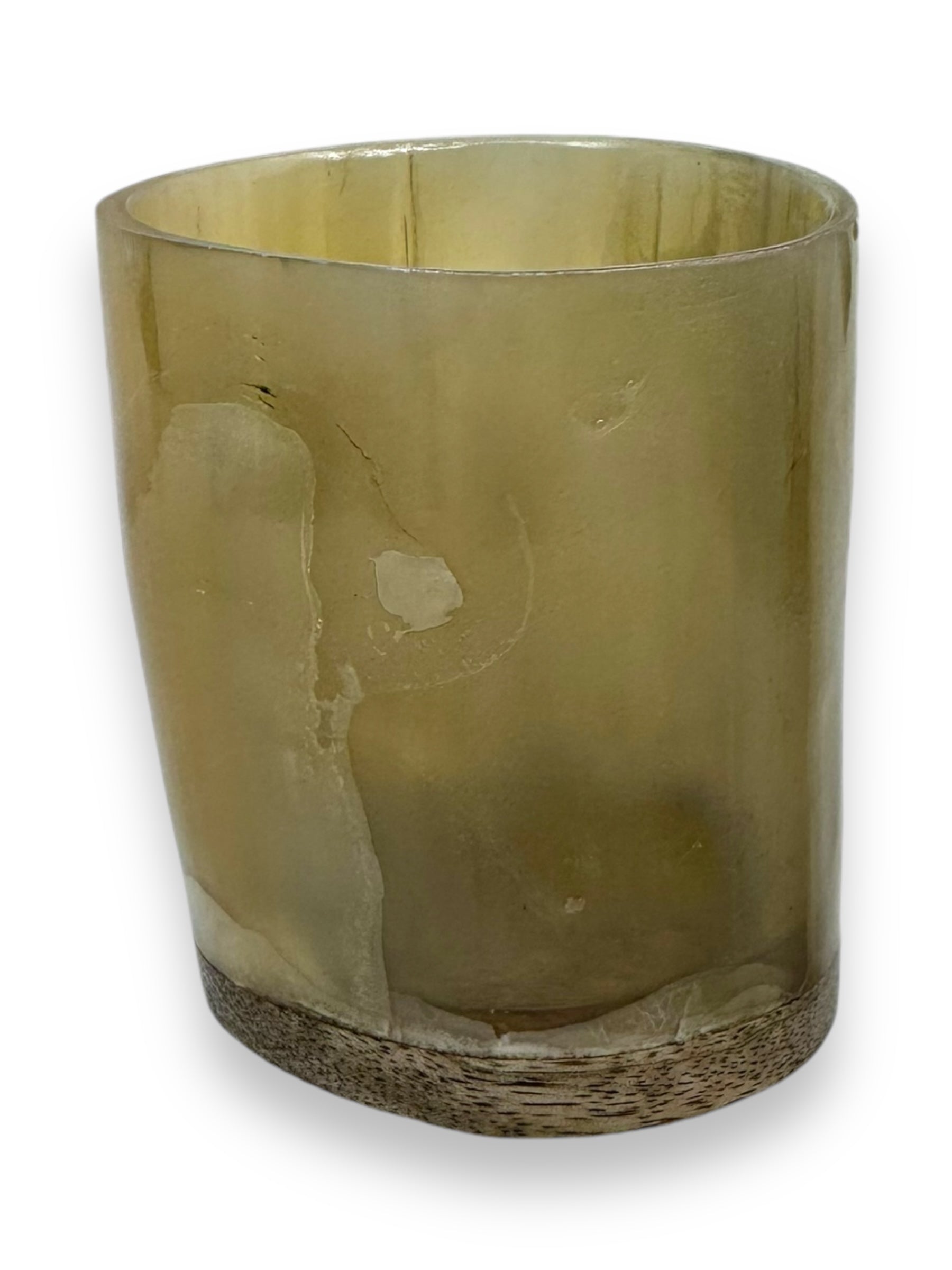 A translucent, cylindrical glass with a textured base and subtle streaks on its surface mimics the elegance of the Horn: Viking Drinking Horn Shot Glass against a white background.