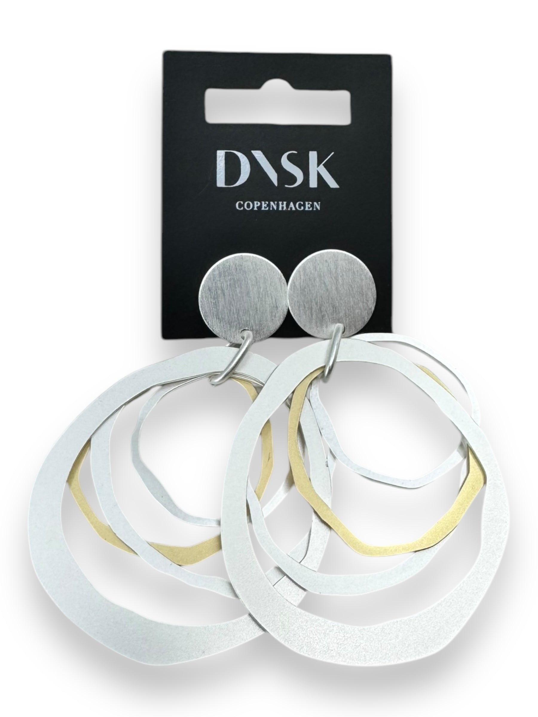 The Alaya Two Tone Elysian earrings on a DASK Copenhagen card, embodying a minimalist Nordic design.