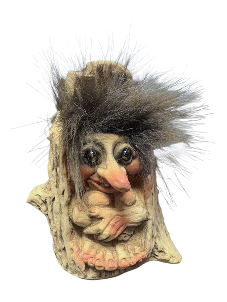 The whimsical sculpture Troll: NyForm - Troll in a Tree Stump features exaggerated facial features and wild hair. As a true collectors item, it embodies distinctive charm and authentic Norwegian design.