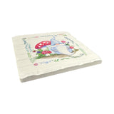 Square cushion with a gnome, red mushrooms, green leaves, and flowers on white—pair with our Spring Tomte Gnomes Tumbled Tile Coaster Set of 4 (4" square) for a charming set featuring absorbent stone and cork backing.