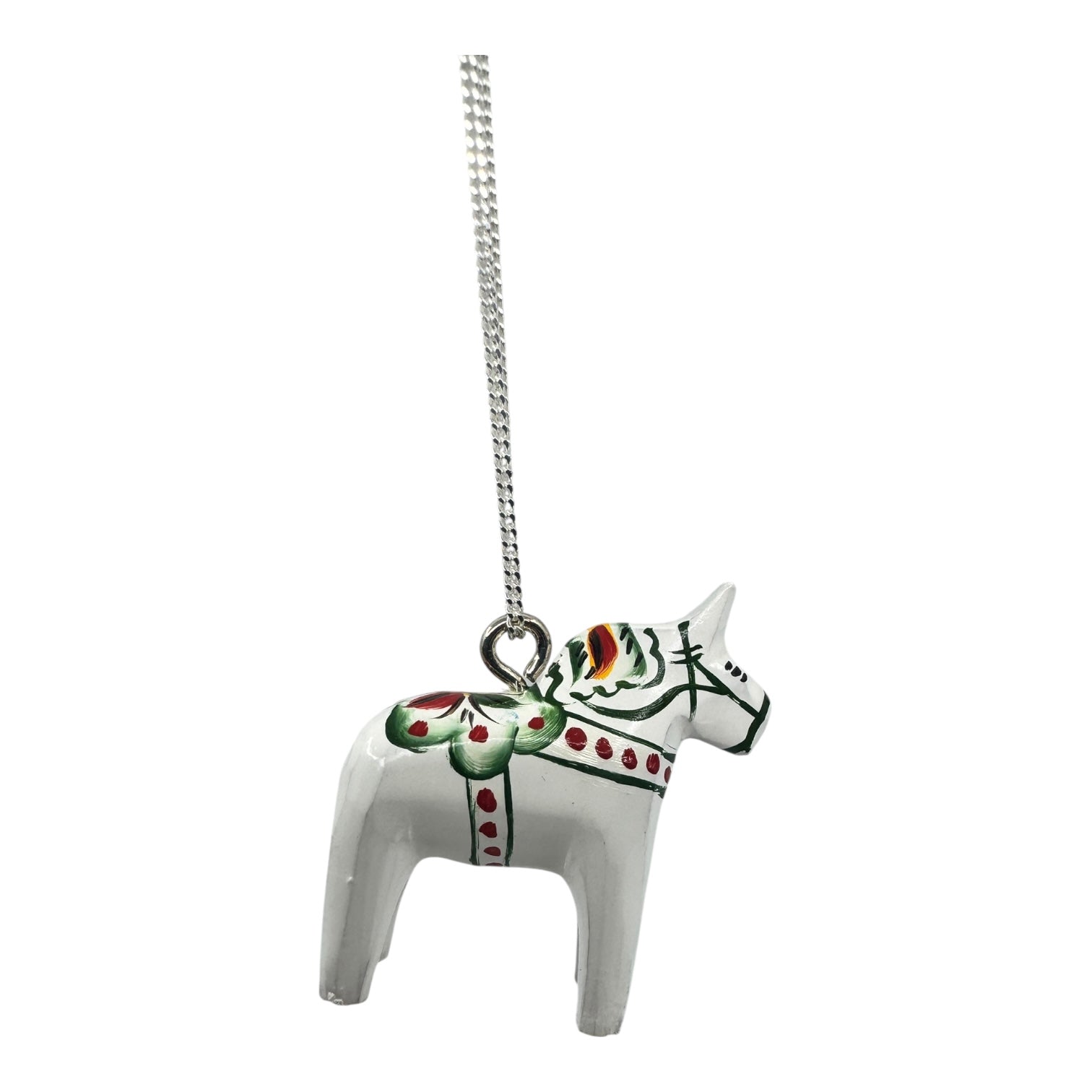 A handcrafted White Dala Horse Pendant (2cm/0.75) with green, red, and yellow patterns hangs from a 19 sterling silver chain—a charming Swedish Folk Art-inspired Necklace.