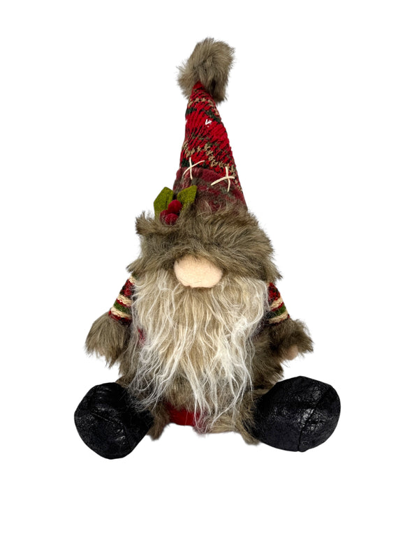 The Gnome: Sitting Santa Gnome – Weighted Holiday Table Decoration (13 Tall) features a plush figure with a long white beard, leafy red and brown hat, brown fur accents, and black feet—ideal as a Nordic Christmas decoration.