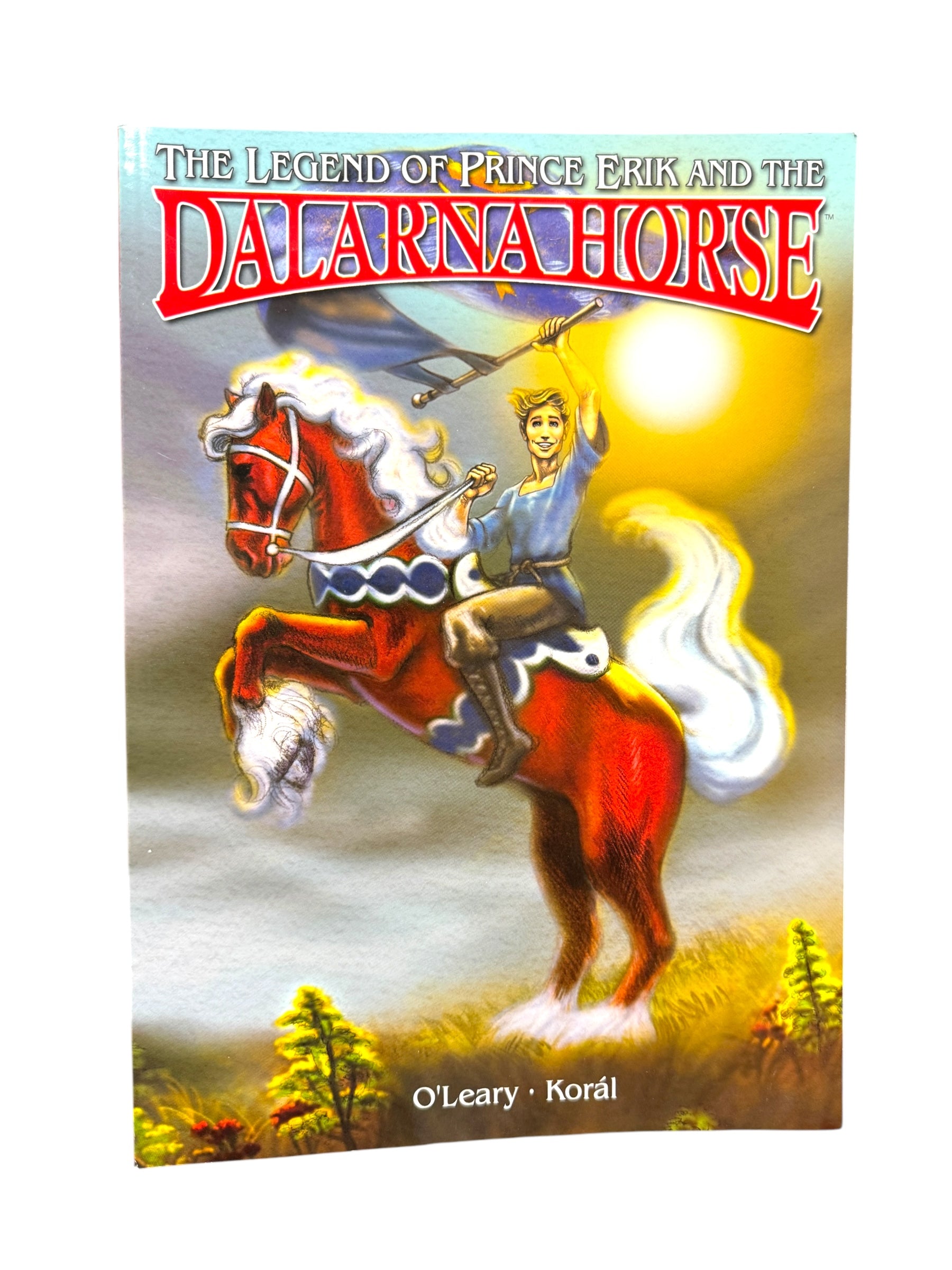 The book cover for The Legend of Prince Erik and The Dalarna Horse features a comic book-style illustration of a man on a rearing horse wielding a sword, set against the vibrant colors of sunrise or sunset. Authors OLeary and Korál bring this epic tale to life.