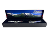 The Jagged Norwegian Cheese Slicer & Cutter features a pewter handle with a Viking ship and moose, and comes boxed—a unique souvenir that celebrates Scandinavian heritage.