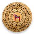 An 8" alder wood trivet features a red Swedish Dala horse at the center, surrounded by laser-cut heart shapes. This handmade piece from Estonia is displayed from above on a white background.