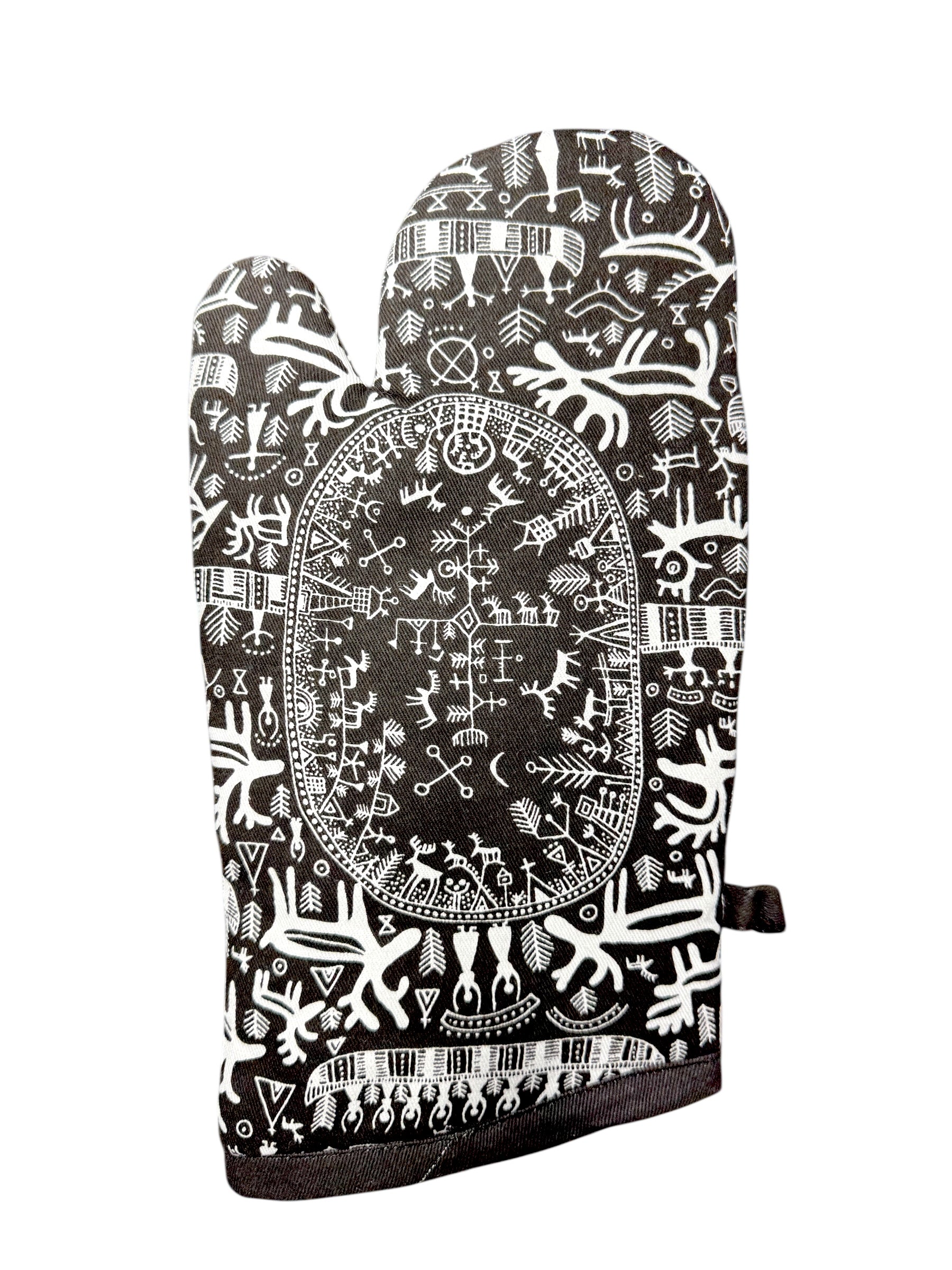 The Oven Mitt: Noir Sami Drawings by Heidi Lange, shown on a white background, features intricate black and white abstract patterns and symbols inspired by Nordic tradition.