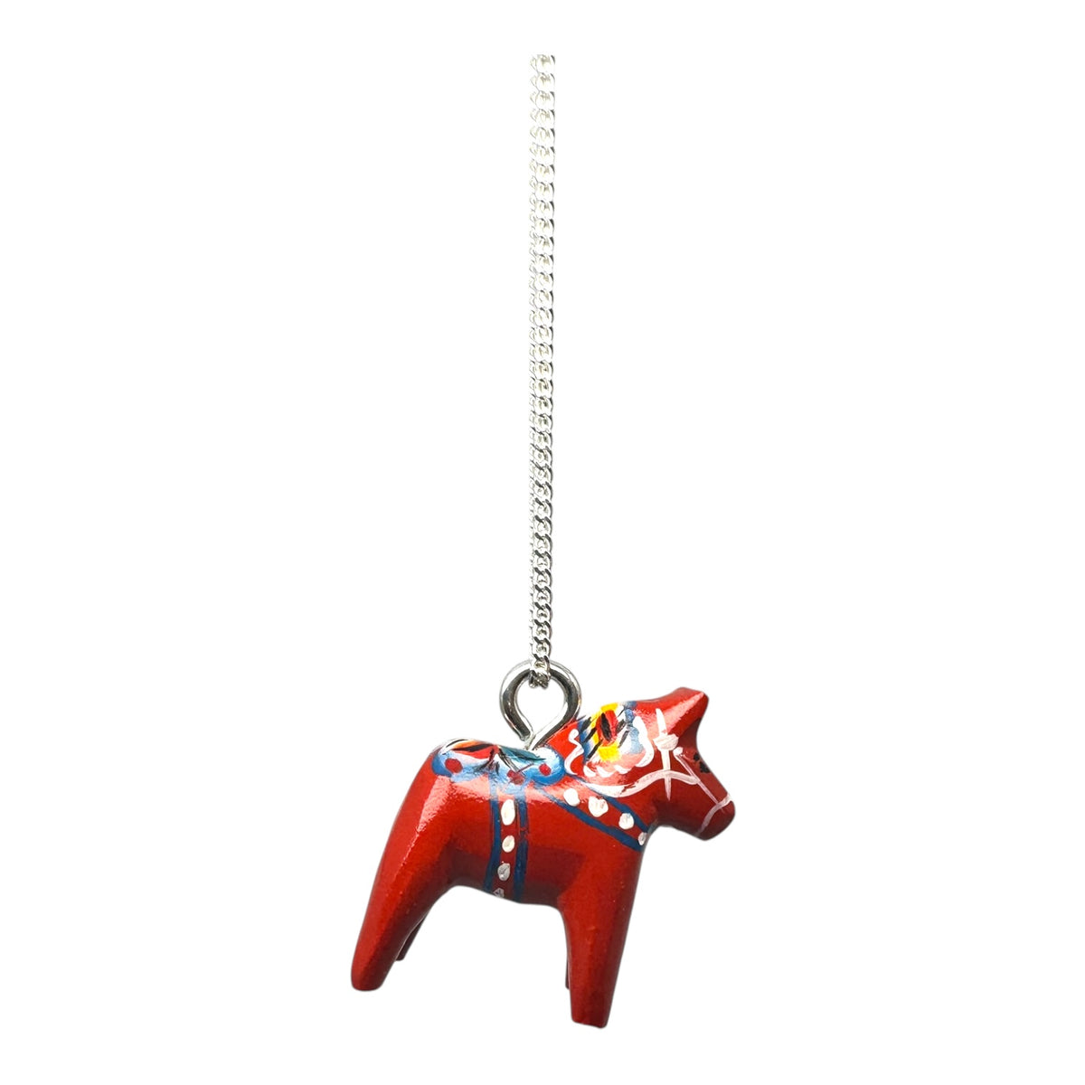 The Necklace: Red Dala Horse Necklace features a 2cm hand-painted wooden horse pendant with Swedish folk art, suspended from a 19 sterling silver chain.