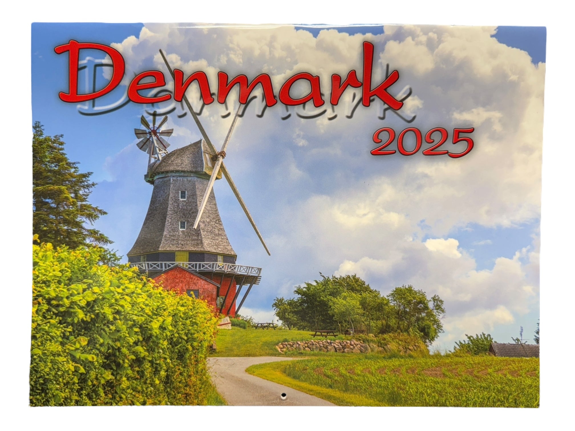 A scenic image of a windmill surrounded by greenery features the text Denmark/Danmark 2025 from the Nordiskal Bilingual Wall Calendar.