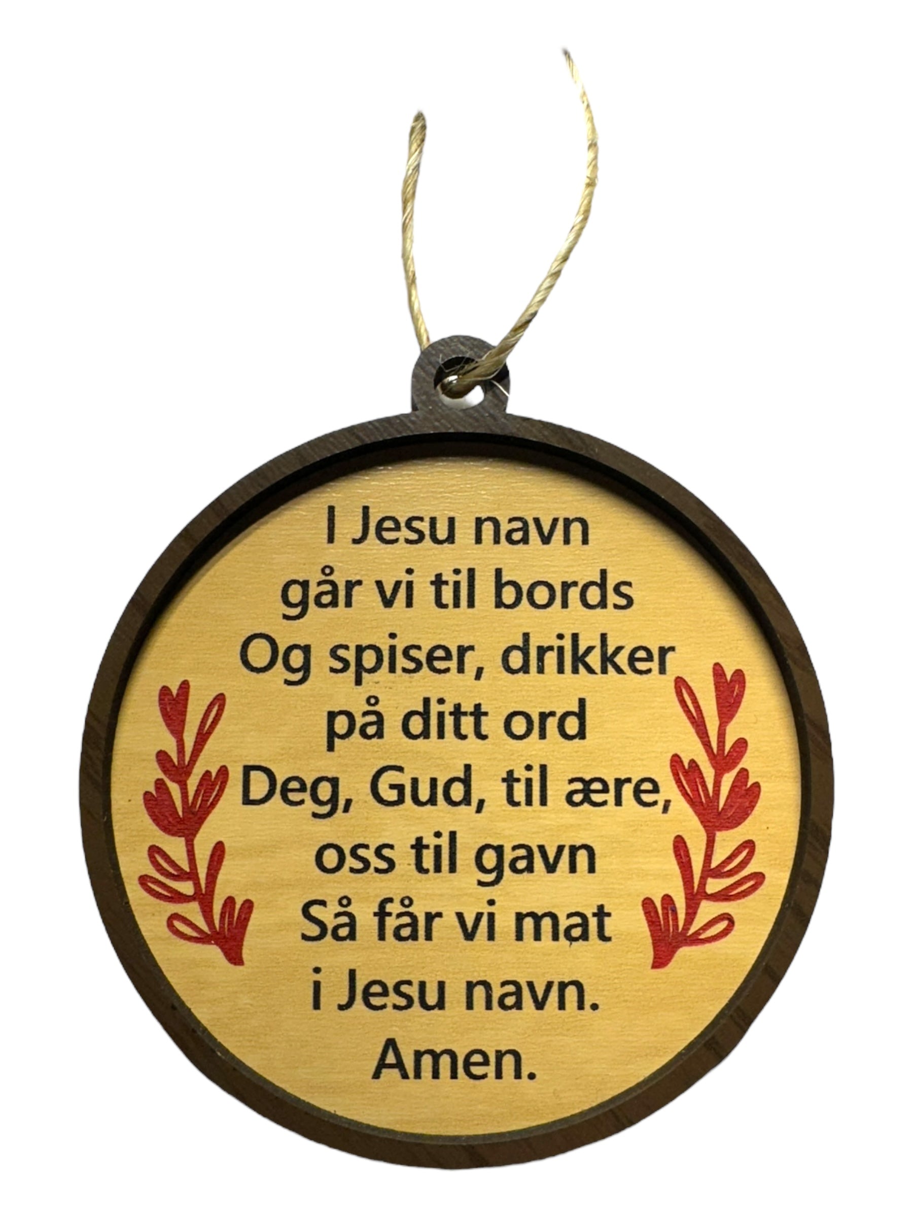 The Ornaments: Norwegian Table Prayer is a round wooden ornament with a Norwegian mealtime prayer, red leaf accents, and a string for hanging.