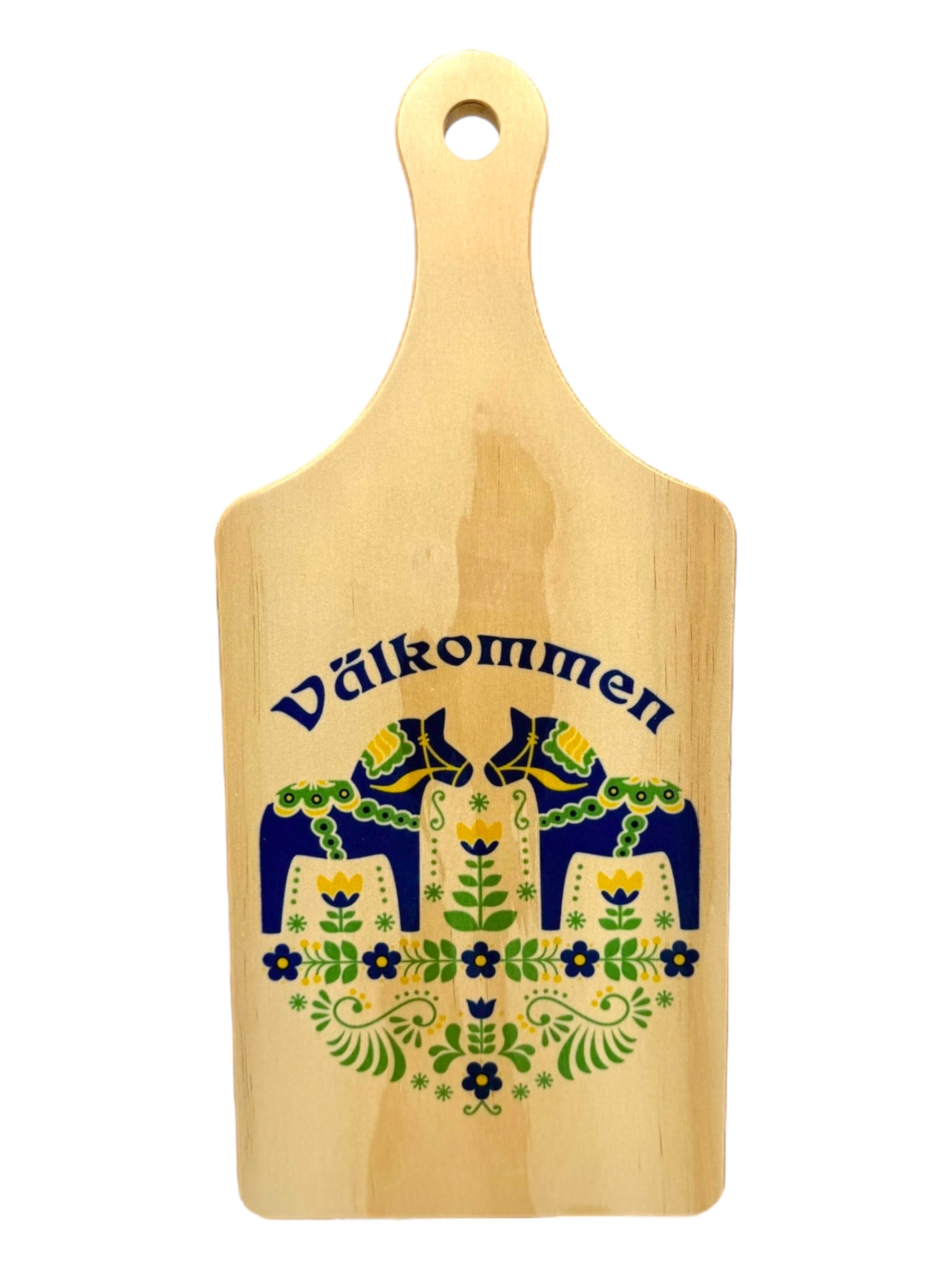 A bamboo cutting board featuring a Scandinavian Dala horse and floral motif, with Välkommen printed in blue at the top. Product: Välkommen Bamboo Blue Dala Horse Cutting Board.