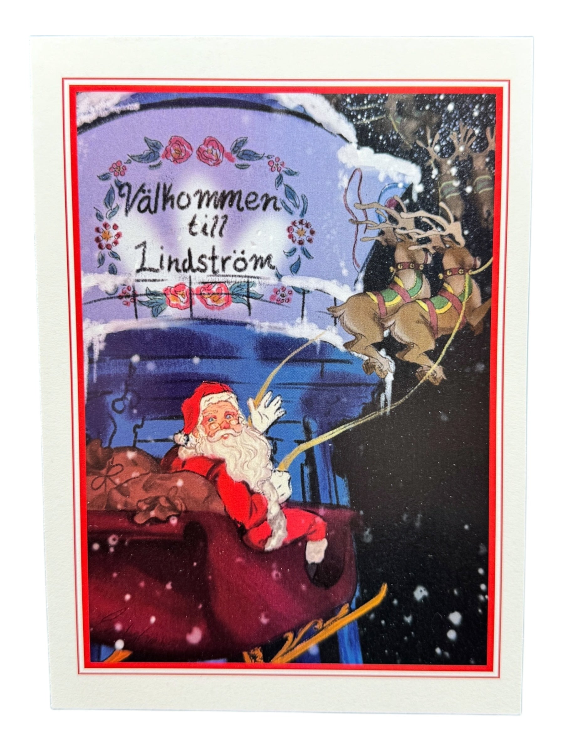 Card: Santa in Lindström – Holiday Greeting Card (5×7 in) features Santa Claus flying over snowy Lindström, passing the Coffee Pot Water Tower and a Välkommen till Lindström sign—perfect for celebrating Swedish heritage.